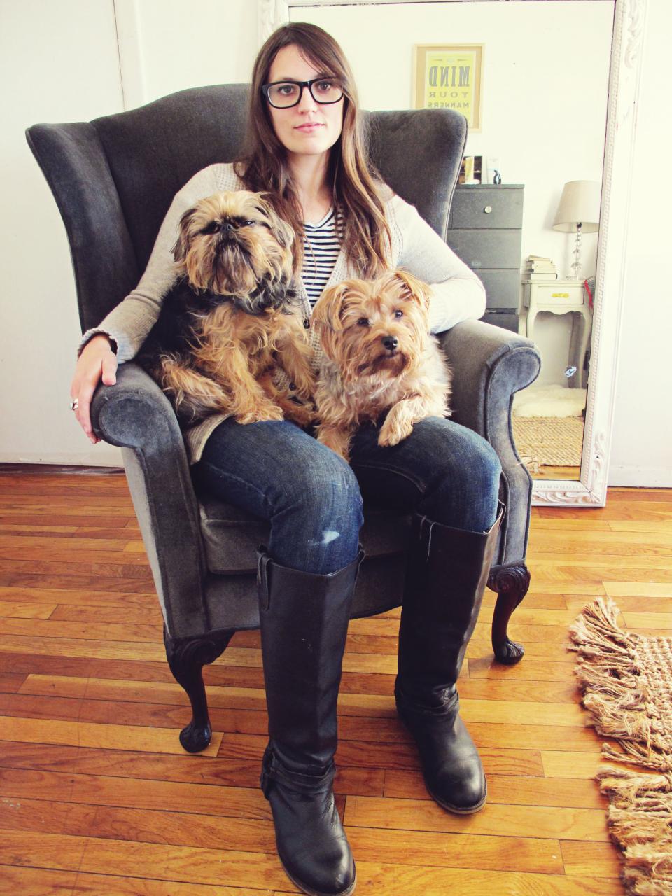 Samantha French sits on armchair with two dogs