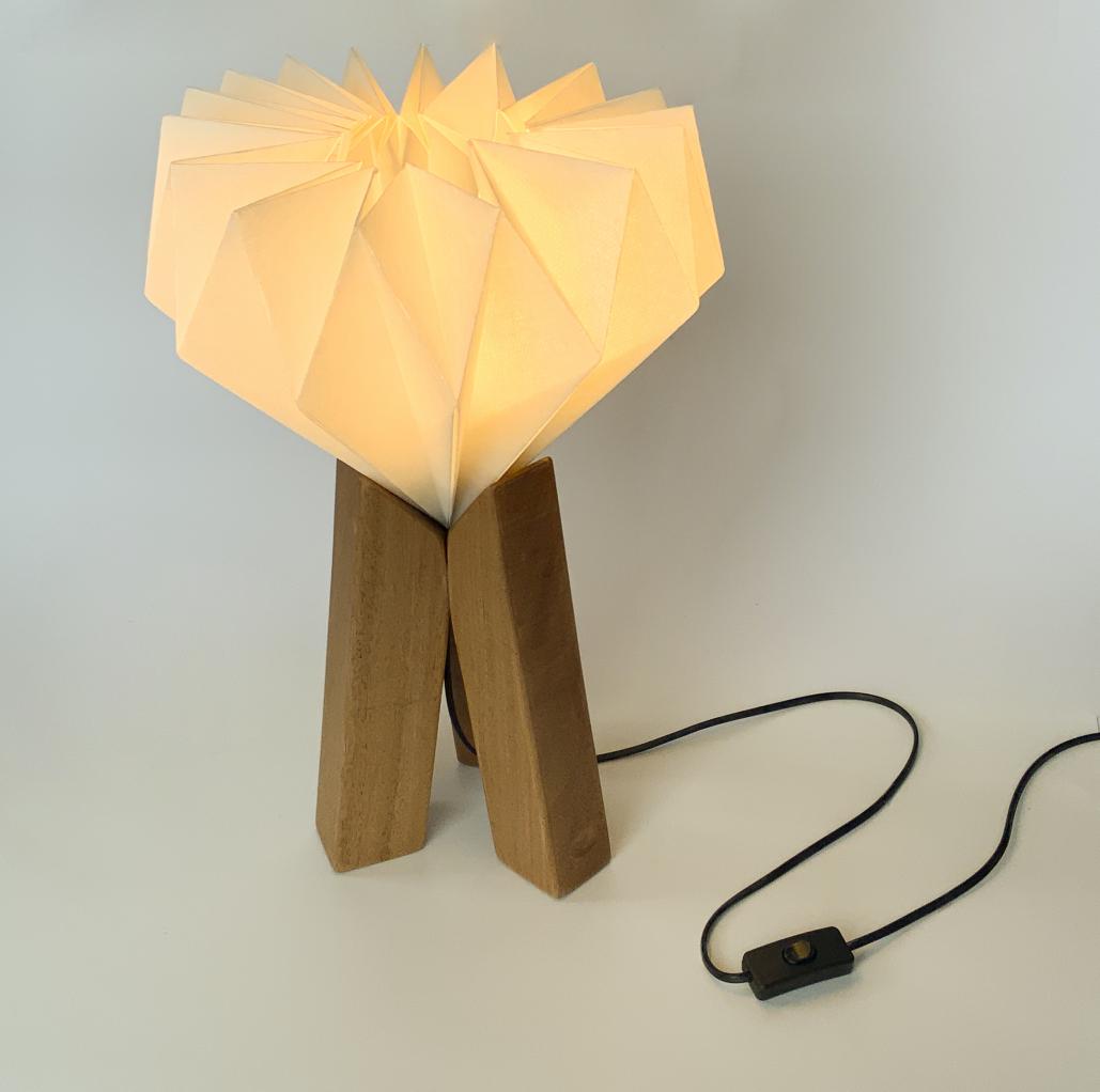 Innovative lamp design focusing on three wooden pillars.