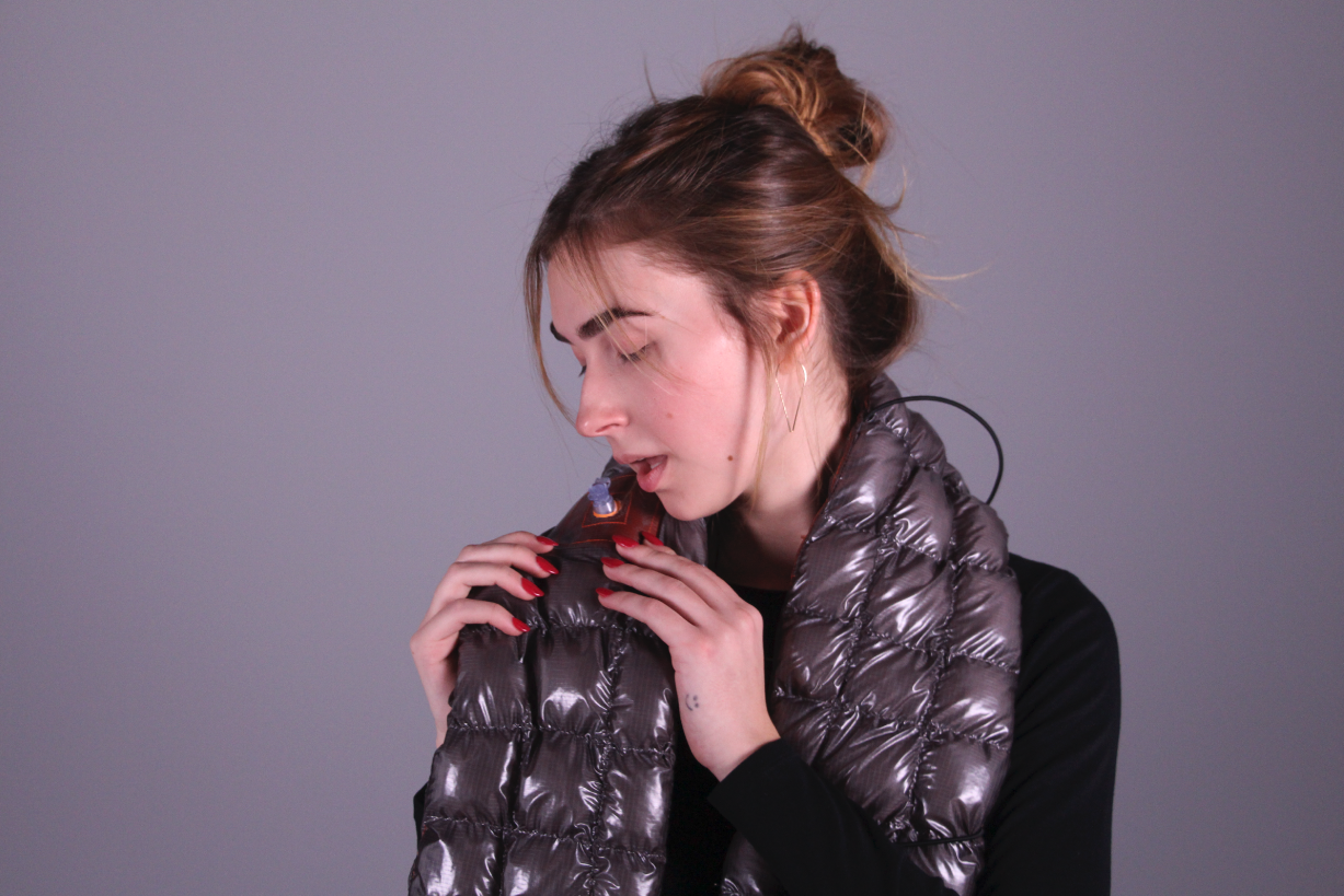 Model wearing an inflatable scarf product design.