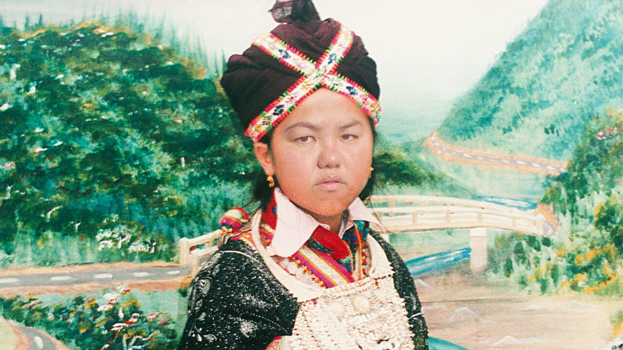 Someone wearing traditional clothing against a watercolored natural background
