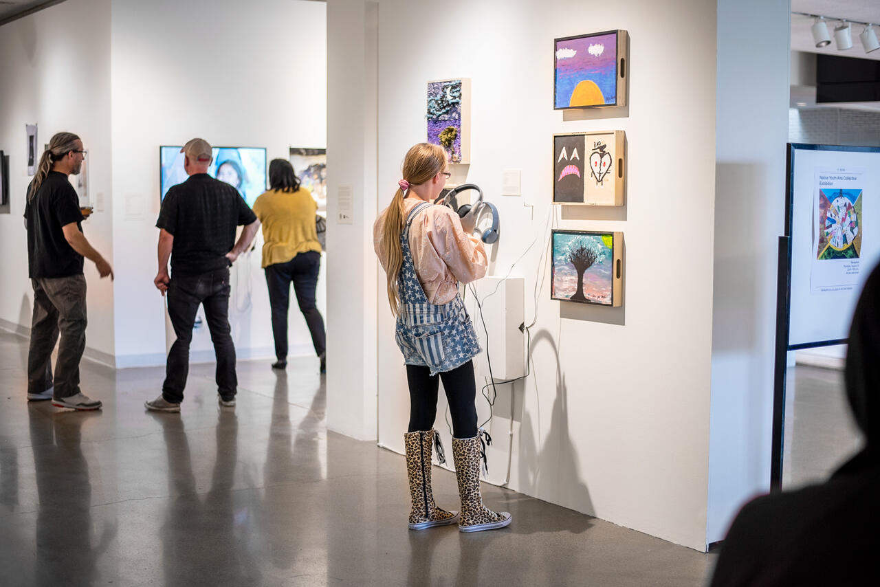 People observing an exhibition in MCAD's Concourse Gallery