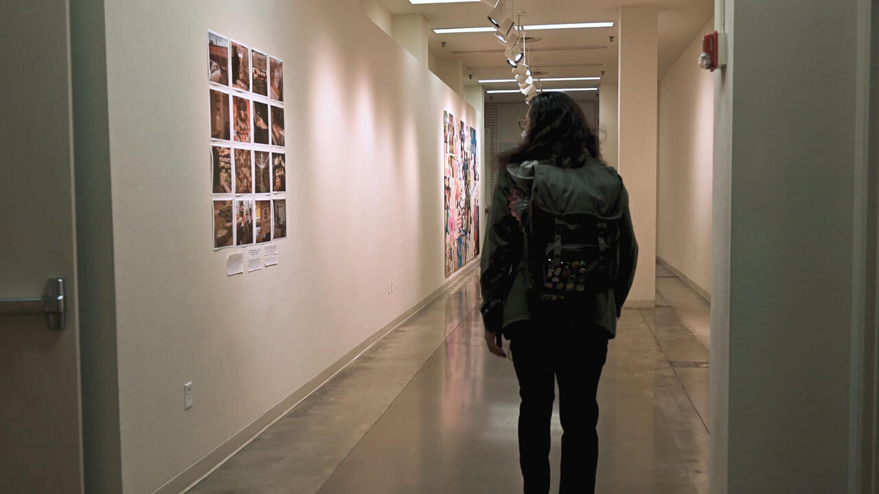 Still from Mau Ojeda's video of a student walking through MCAD's halls