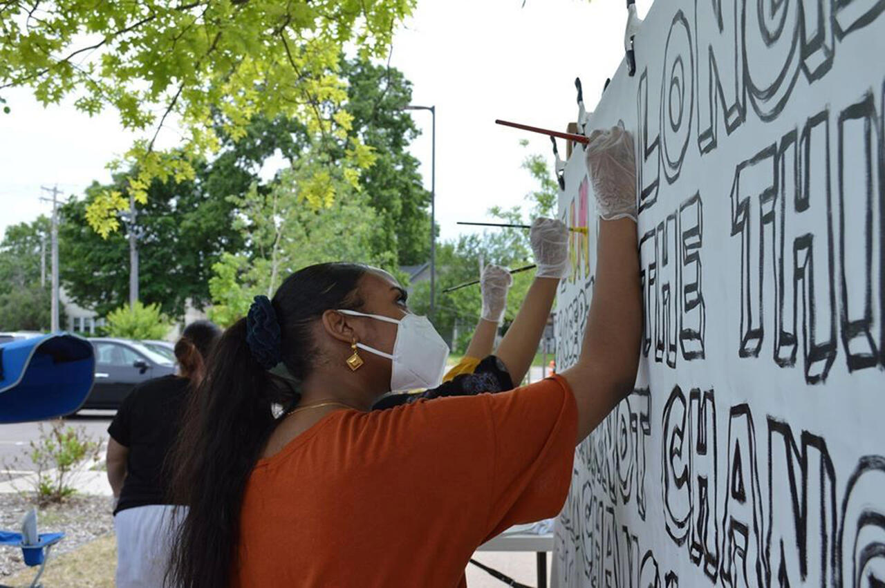 People painting a mural
