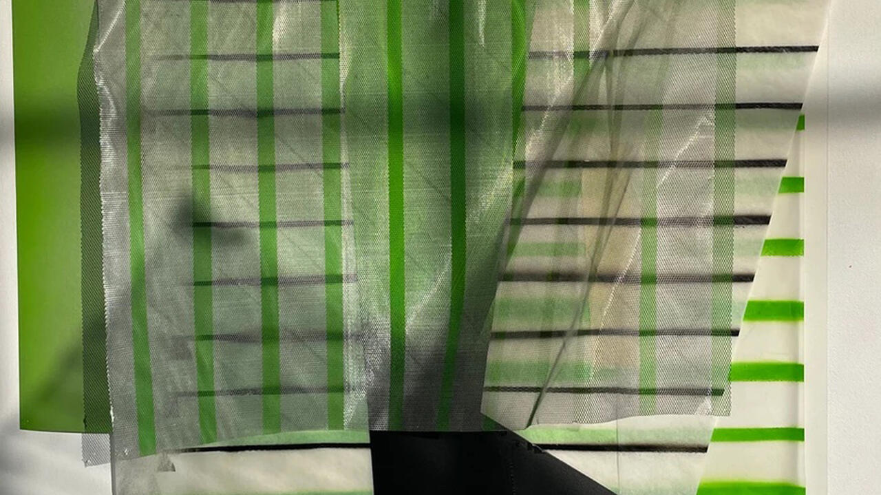 Several overlaid different pieces of translucent paper with different geometric shapes with a green color scheme