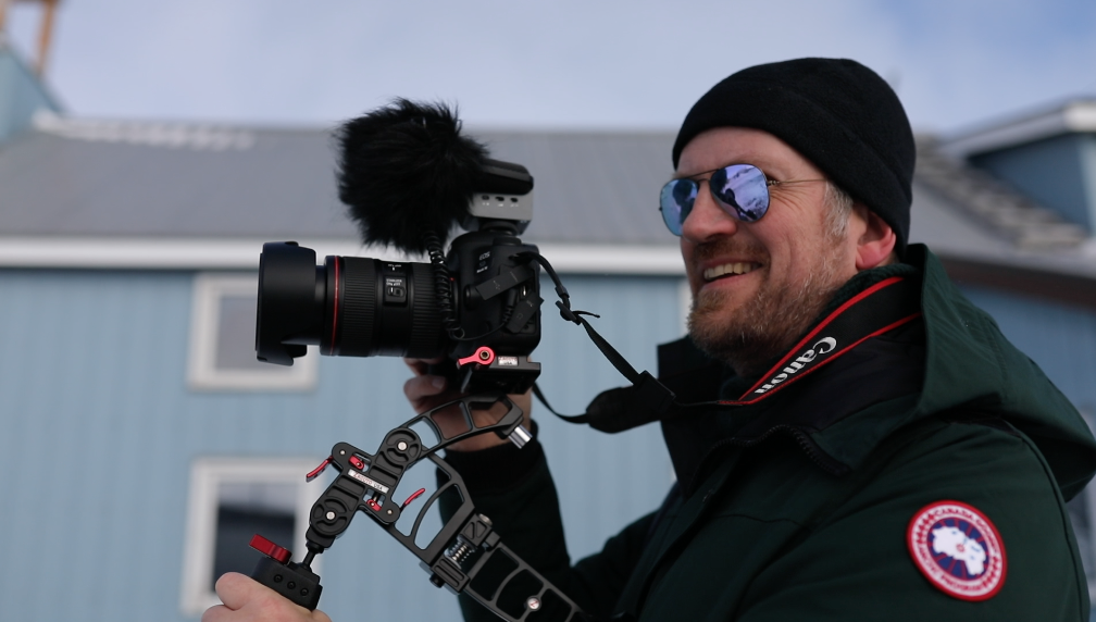 Dr. Olaf Kuhlke holding a camera