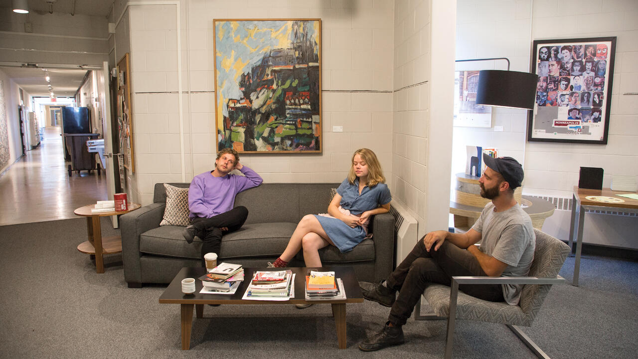 Students chatting on couches in Learning Center