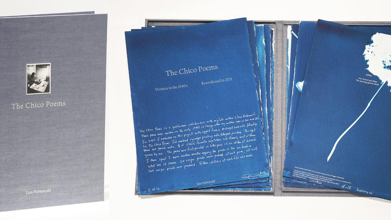 A bound gray book standing next to different blue dyed pages with a white flower and "The Chico Poems" written on them with text underneath