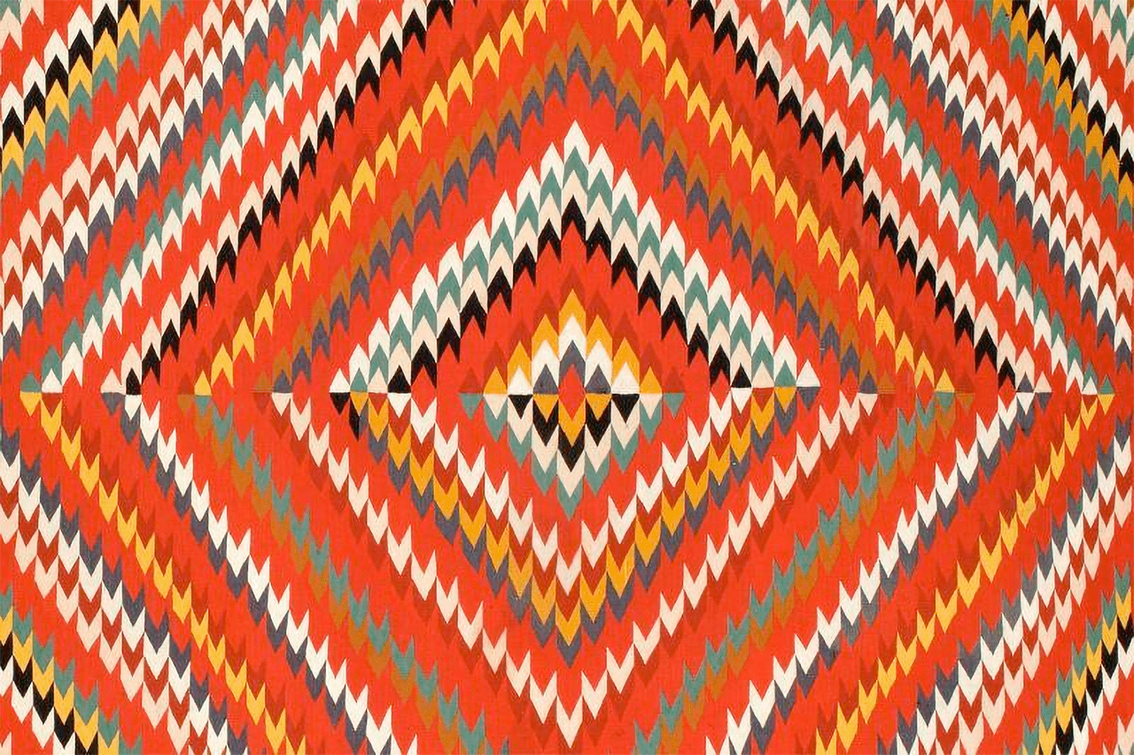 An image of an 1885 Navajo patterned blanket.
