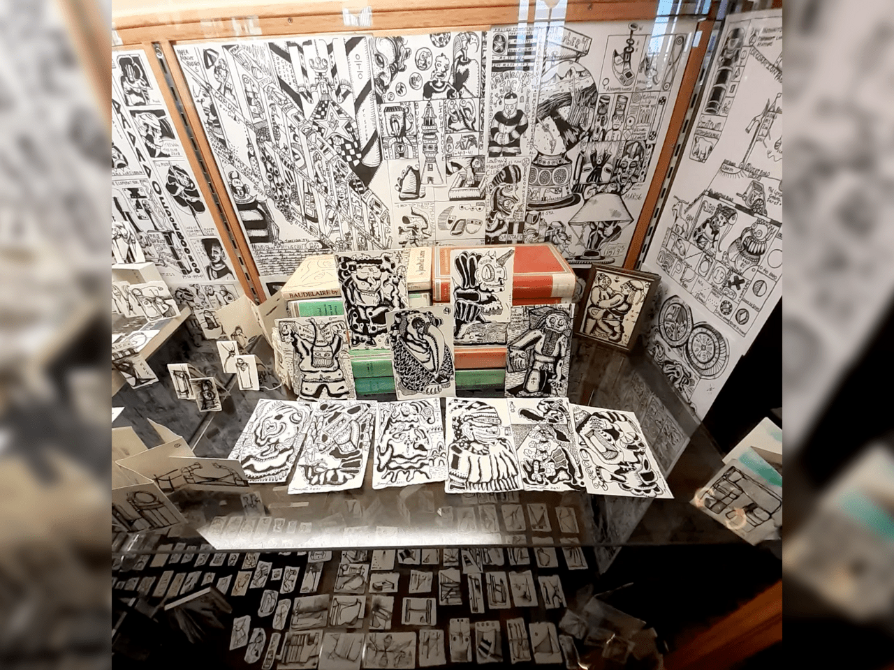 An image of a cabinet with various drawings in it.