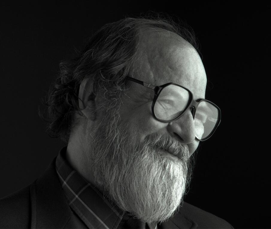 Roman Verostko Professor Emeritus Headshot MCAD Faculty, black and white photograph of Verostko smiling