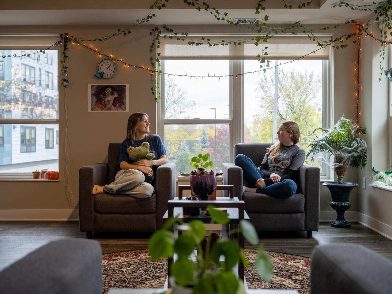 dorm photoshoot header image for admitted student page how to pay, two students in an mcad dorm room 