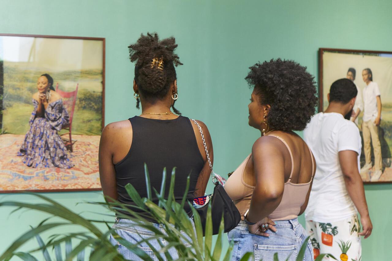 spectators at Grow As We Are exhibition at MCAD