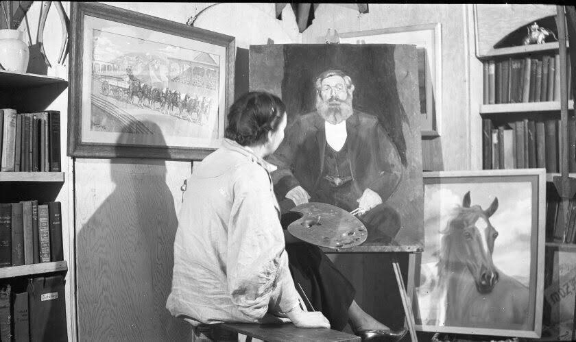 Orabel Thortvedt with painting of her grandfather