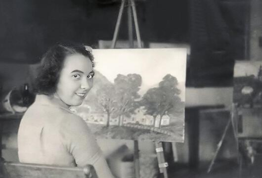 Léone Worden painting a landscape