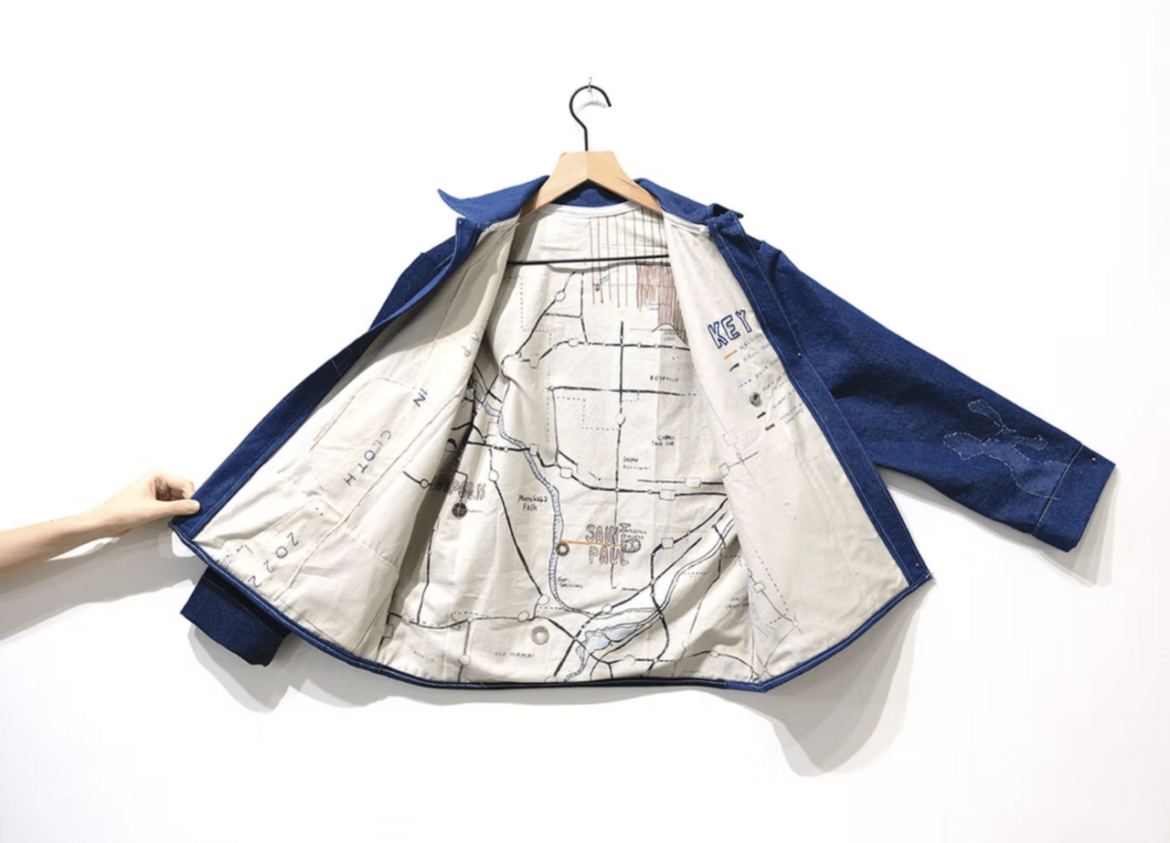 Malini Basu's work. It's a blue jacket with a white interior, embroideried with a map of St.Paul, MN.