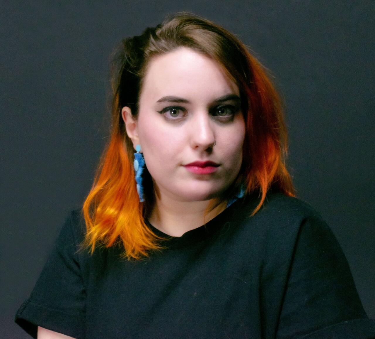 Headshot of Carly Poulsom.