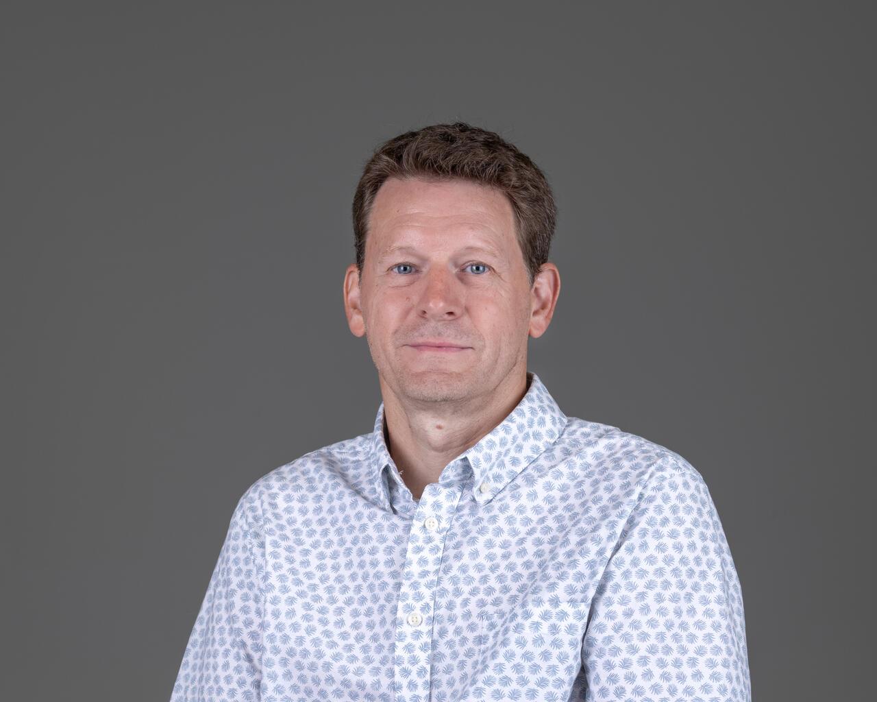 A headshot of Tim Szabo.