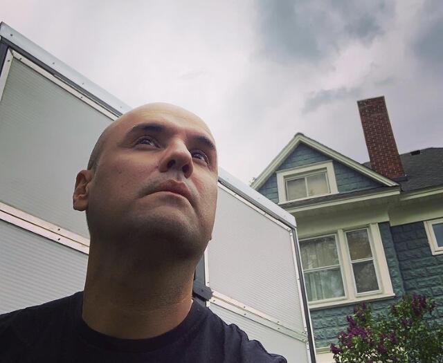 Headshot of Billy Franklin outdoors in a residential neighborhood. 