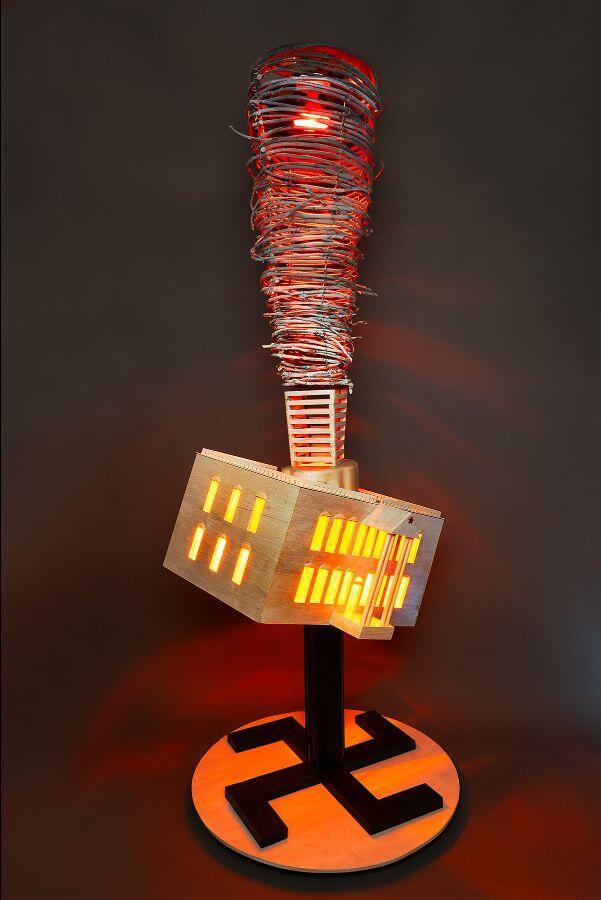Descending Storm by Tom Gormally. The work is a sculpture with a base at the bottom contsinting a swastika, and a tornado made out of wire with the whitehouse floating above it.