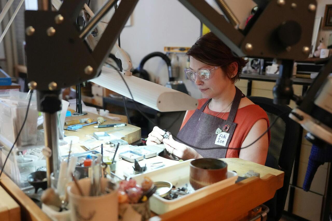 Emily Johnson working on jewlery in her studio.