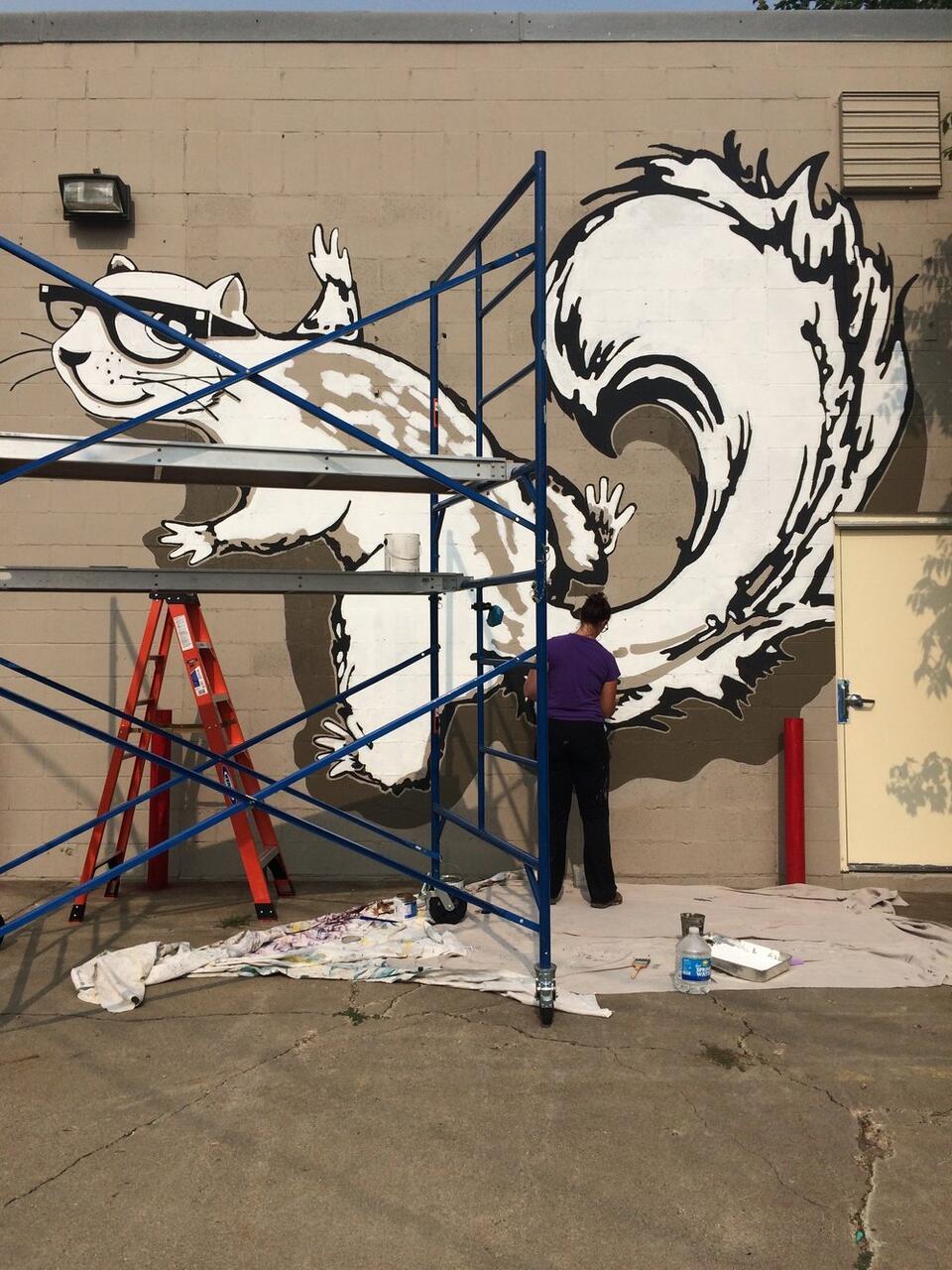 Squirrel Haus Arts mural when it was being painted.